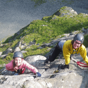 Mother and daughter climbing the Via Ferrate in the Lake District at Honister